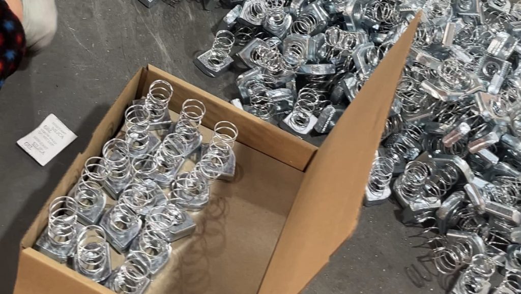 packing up spring channel nut